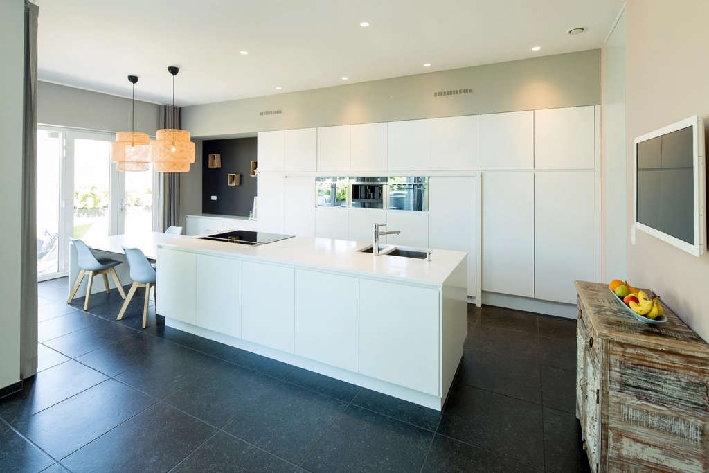 Bright modern kitchen with a long white island